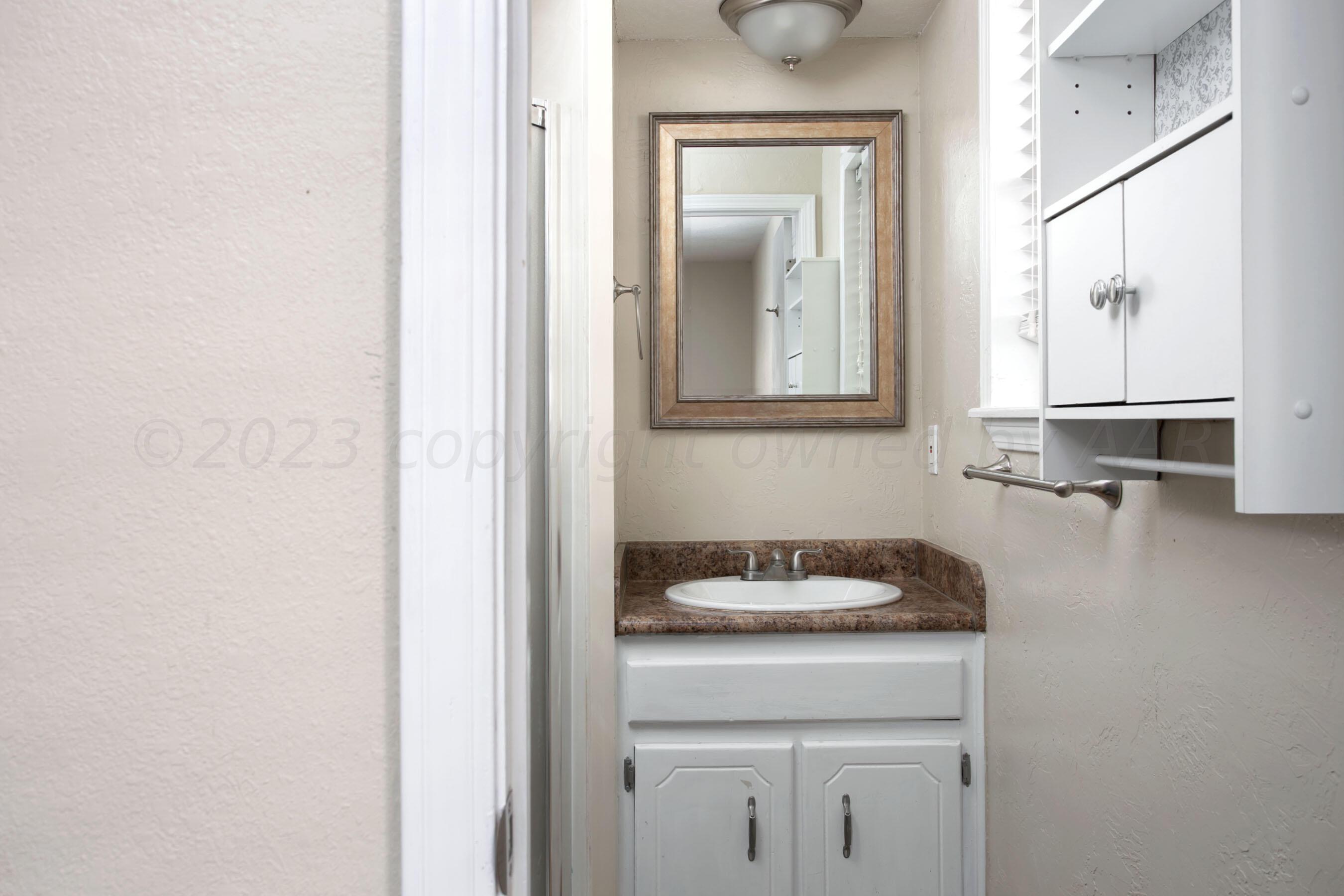 2905 Salem Drive Amarillo, TX 79110 - Photo 23 of 29 a kitchen with a sink and cabinets