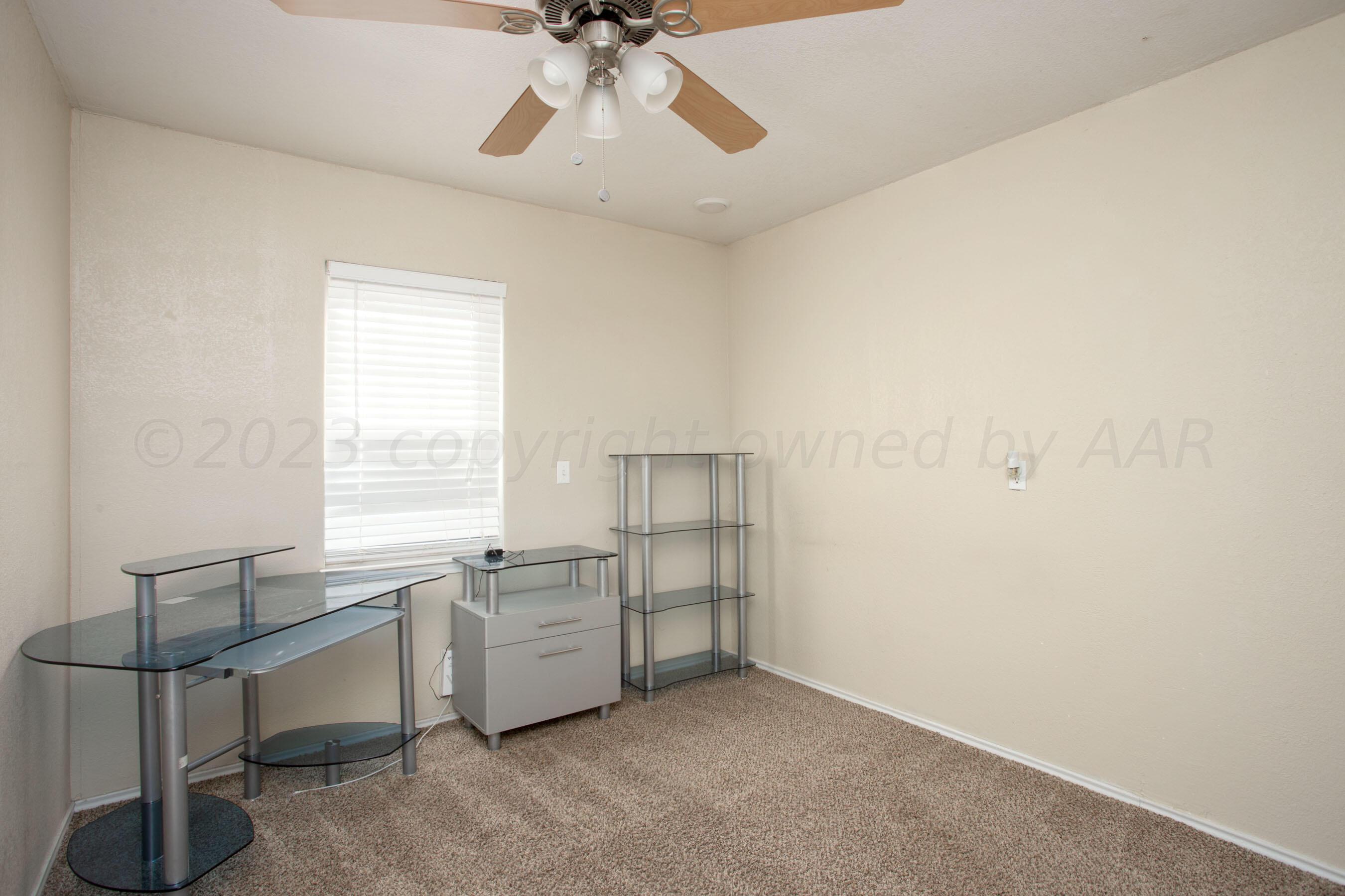 2905 Salem Drive Amarillo, TX 79110 - Photo 25 of 29 a view of a workspace with furniture and window