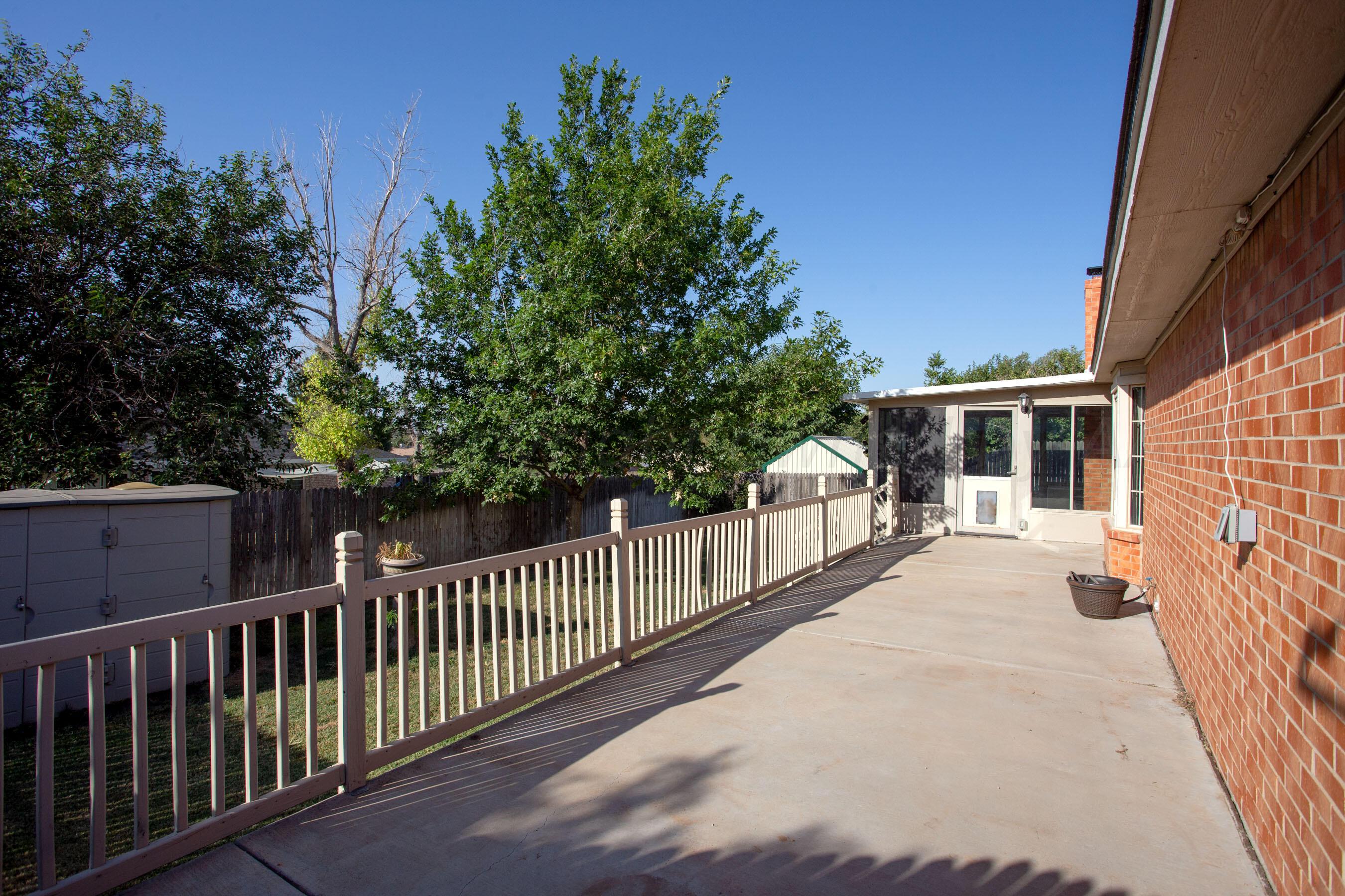 2905 Salem Drive Amarillo, TX 79110 - Photo 27 of 29 a view of a house with a small yard and wooden fence