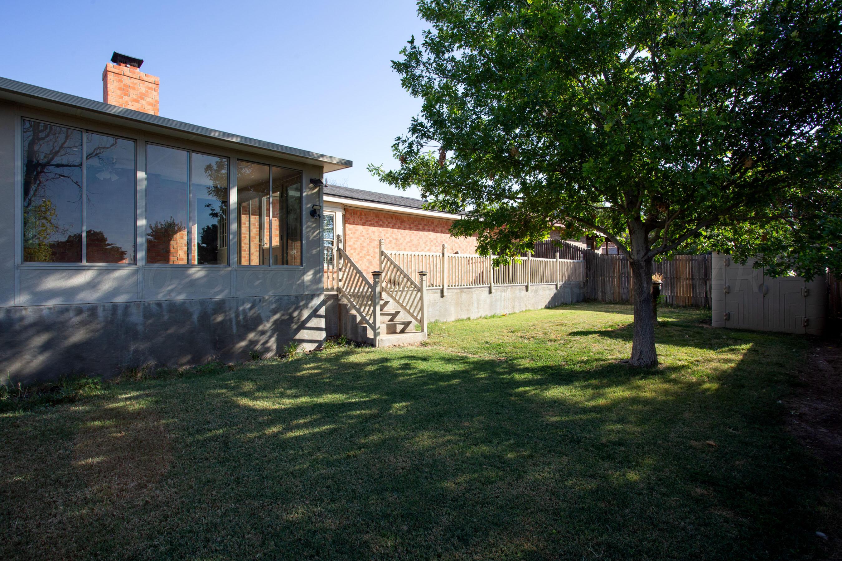 2905 Salem Drive Amarillo, TX 79110 - Photo 28 of 29 a view of a house with backyard and a tree