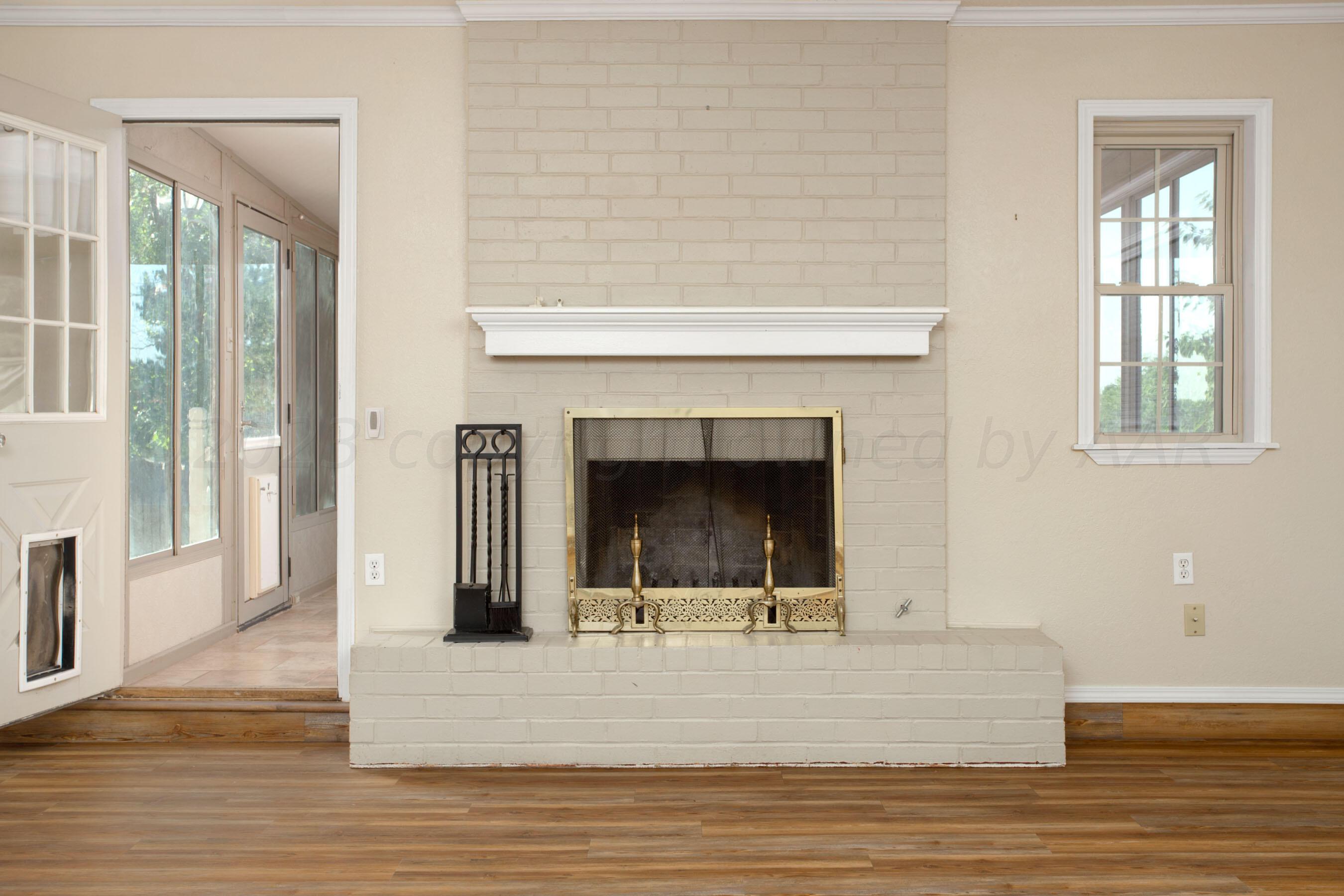 2905 Salem Drive Amarillo, TX 79110 - Photo 7 of 29 a view of a livingroom with a fireplace and window