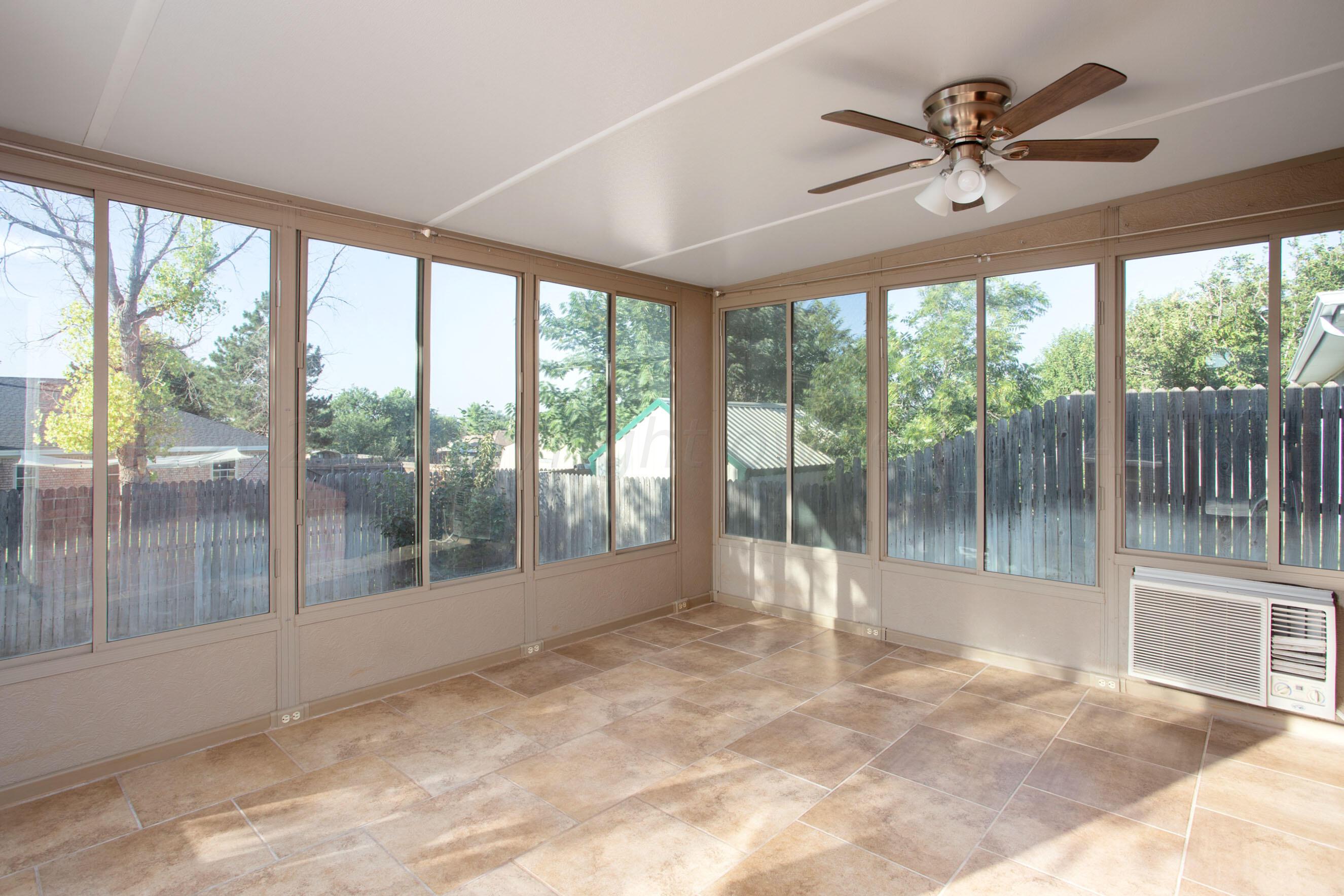 2905 Salem Drive Amarillo, TX 79110 - Photo 8 of 29 a view of empty room with wooden floor and fan
