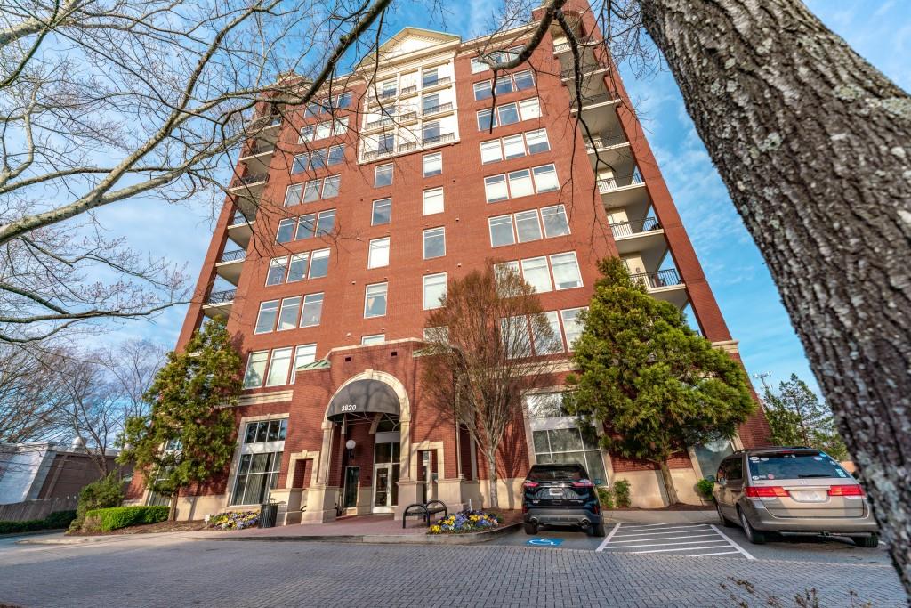 3820 Roswell Road Northeast, Unit 705 Atlanta, GA 30342 - Photo 12 of 62 a couple of cars parked in front of a building
