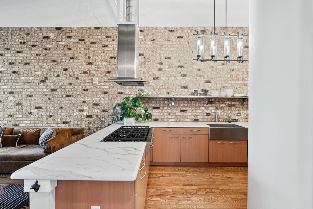 3820 Roswell Road Northeast, Unit 705 Atlanta, GA 30342 - Photo 17 of 62 a kitchen with a stove a sink and a refrigerator