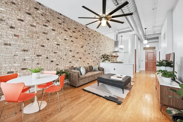 a view of walk in closet with clothes