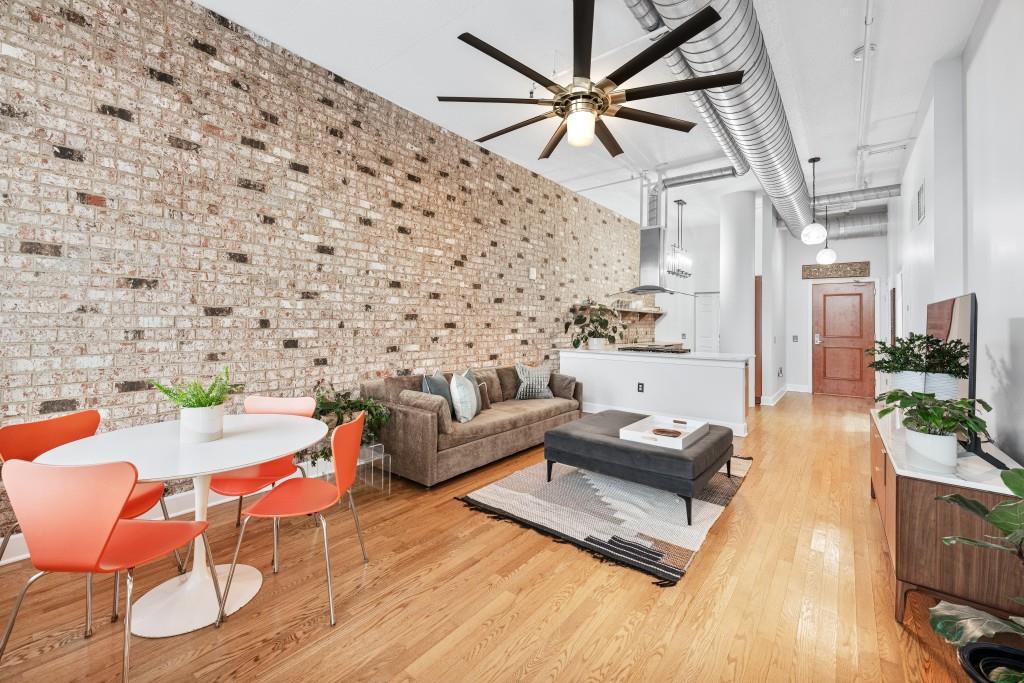 3820 Roswell Road Northeast, Unit 705 Atlanta, GA 30342 - Photo 23 of 62 a living room with furniture and wooden floor