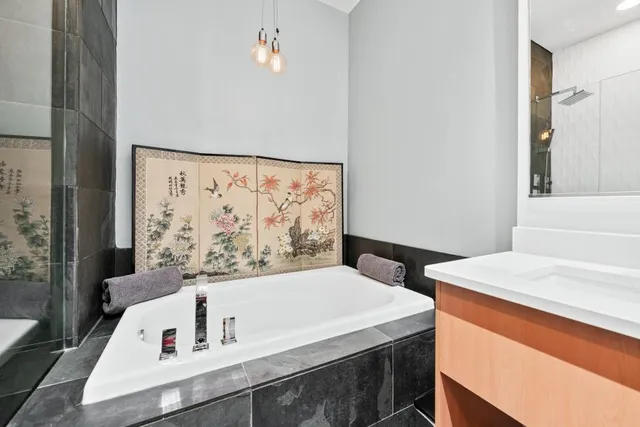 a bathroom with a toilet a sink and a mirror