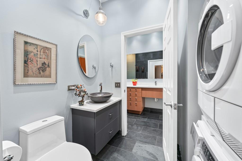 3820 Roswell Road Northeast, Unit 705 Atlanta, GA 30342 - Photo 28 of 62 a bathroom with a toilet a sink and a mirror