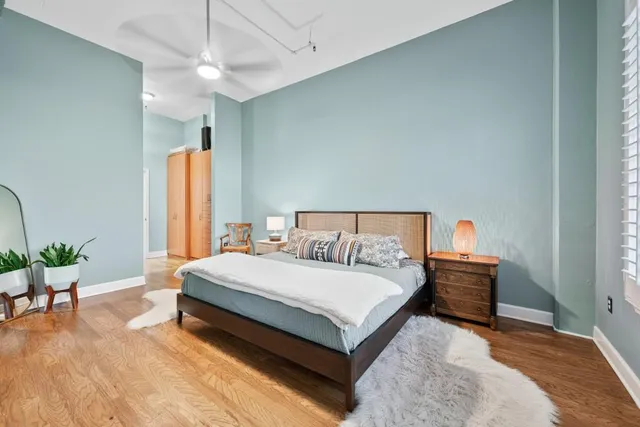 a bathroom with a double vanity sink a mirror and a bathtub