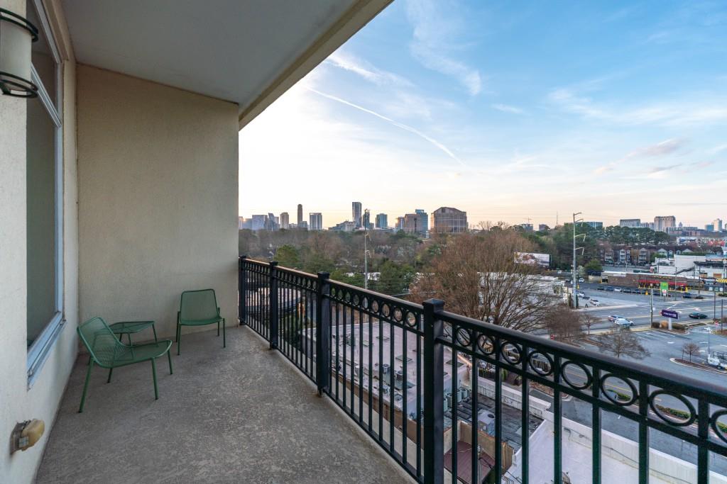 3820 Roswell Road Northeast, Unit 705 Atlanta, GA 30342 - Photo 31 of 62 a view of a city from a balcony with furniture
