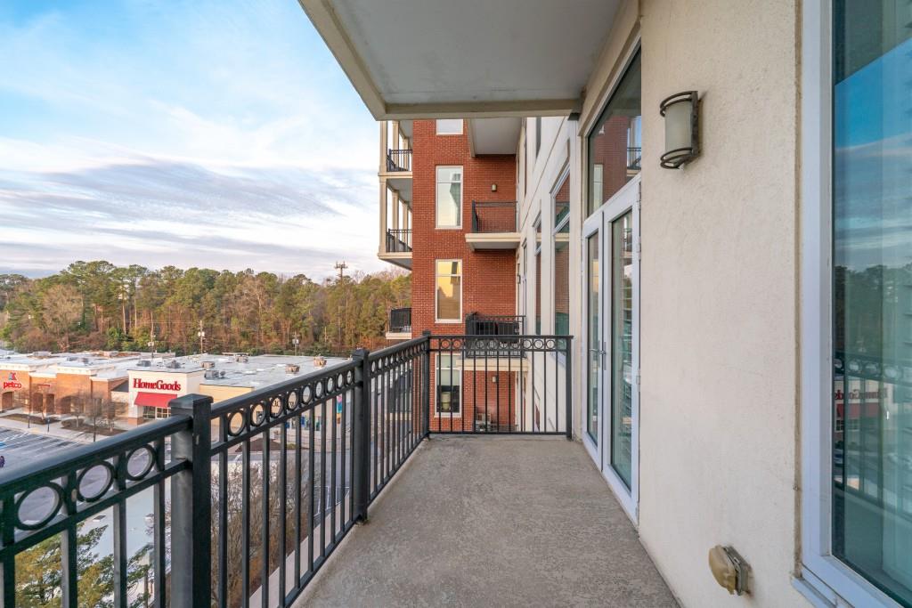 3820 Roswell Road Northeast, Unit 705 Atlanta, GA 30342 - Photo 32 of 62 a view of a balcony with wooden floor and city view