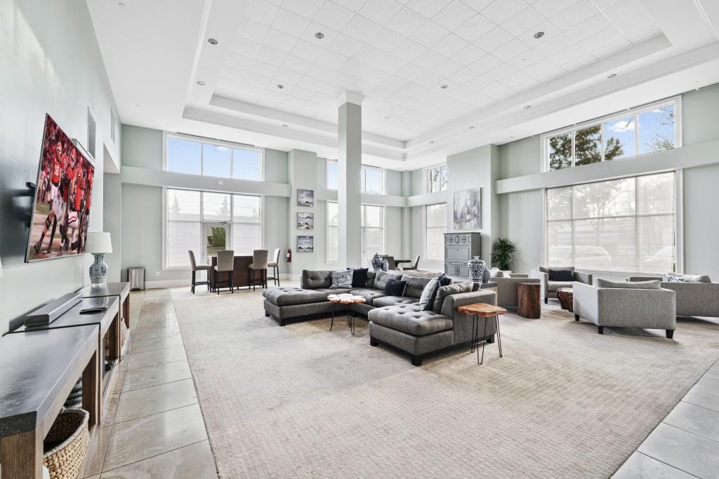 3820 Roswell Road Northeast, Unit 705 Atlanta, GA 30342 - Photo 36 of 62 a living room with furniture and a large window
