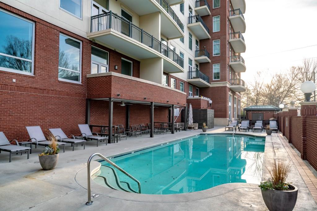 3820 Roswell Road Northeast, Unit 705 Atlanta, GA 30342 - Photo 38 of 62 a view of a patio with swimming pool