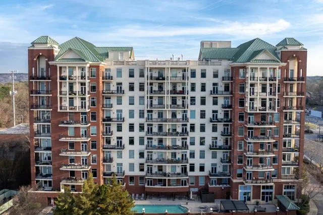 an aerial view of a residential houses with outdoor space