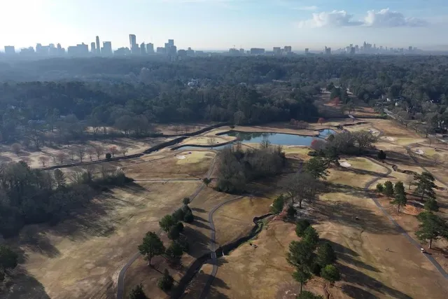 a couple of cars parked in front of a building