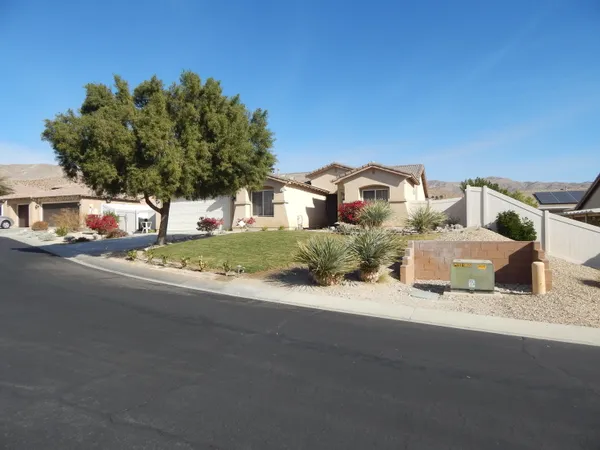 a picture of a houses with a yard