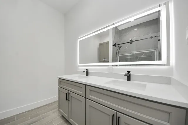 a bathroom with a sink and a white cabinet