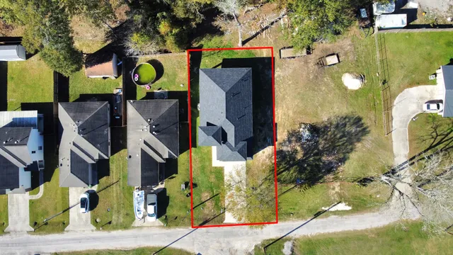 an aerial view of houses with yard