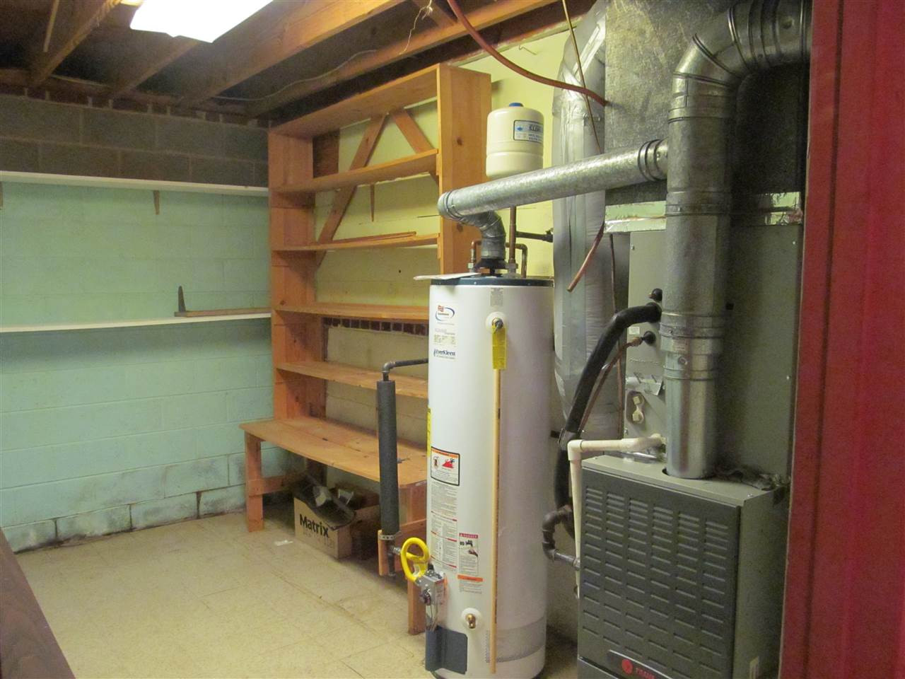 3409 Doyle Road Raleigh, NC 27607 - Photo 21 of 25 Workshop/storage area containing HVAC equipment and water heater. Utility Room