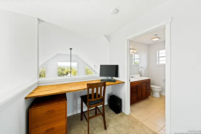 a view of a workspace with furniture