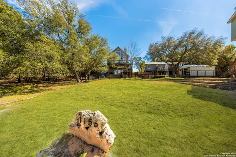a view of a swimming pool with an outdoor space and seating area