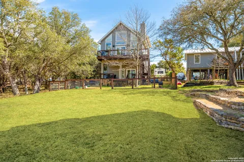 a front view of a building with a garden