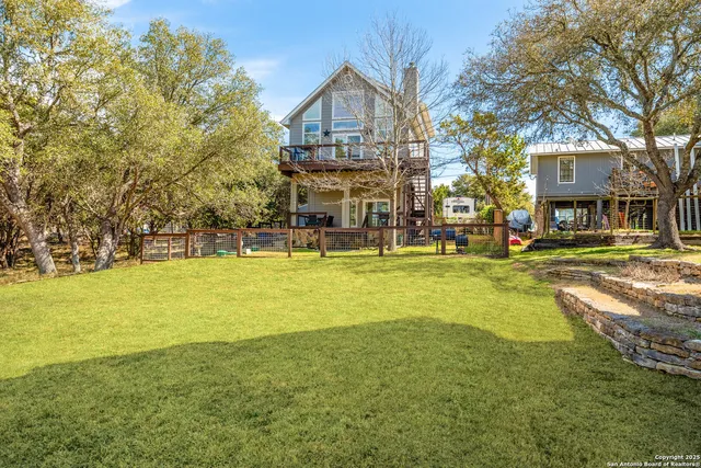 a front view of a building with a garden