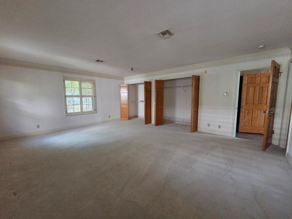 2212 Rock Creek Drive Kerrville, TX 78028 - Photo 17 of 36 an empty room with windows and closet