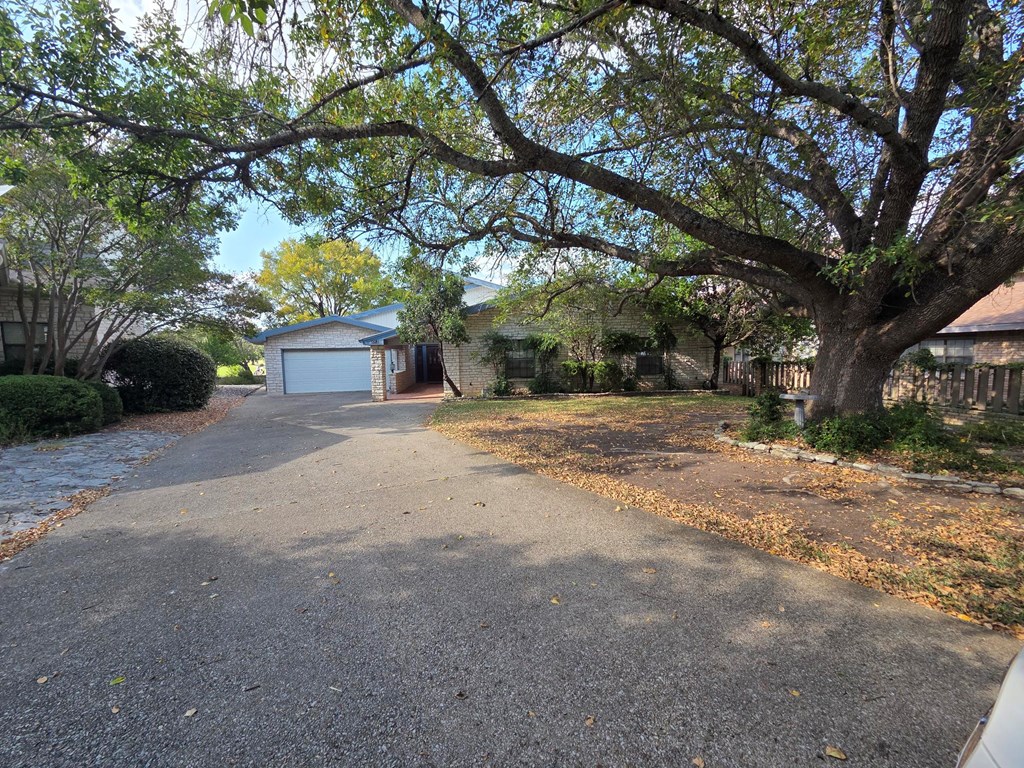 2212 Rock Creek Drive Kerrville, TX 78028 - Photo 2 of 36 a view of a house with a large tree