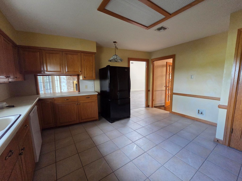 2212 Rock Creek Drive Kerrville, TX 78028 - Photo 21 of 36 a kitchen with stainless steel appliances a refrigerator and window