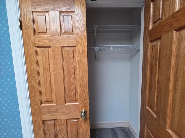 a view of front door with wooden floor