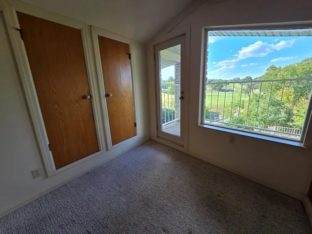 a view of a room with a large window