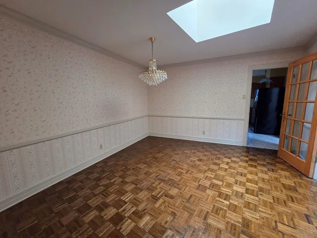 a view of a room with rack on the wall and a shower
