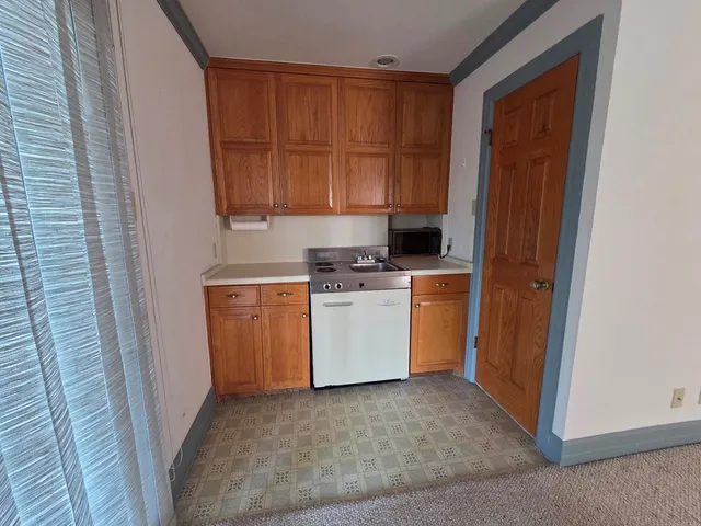 a utility room with a sink a washer and dryer