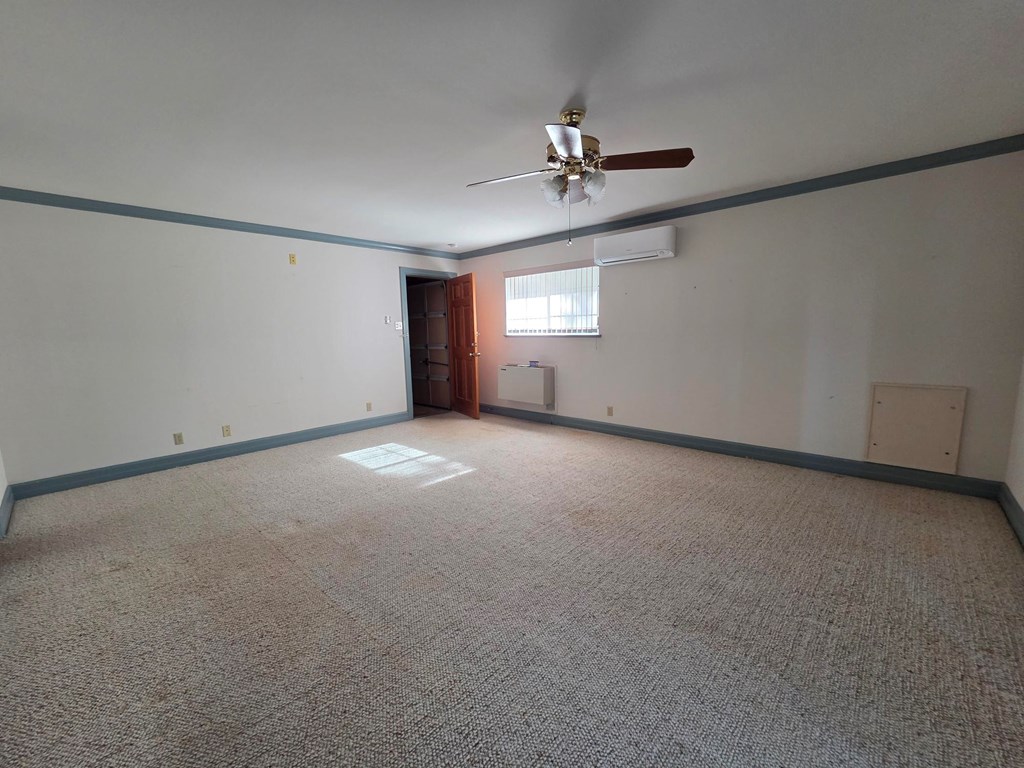 2212 Rock Creek Drive Kerrville, TX 78028 - Photo 7 of 36 a view of an empty room with a window