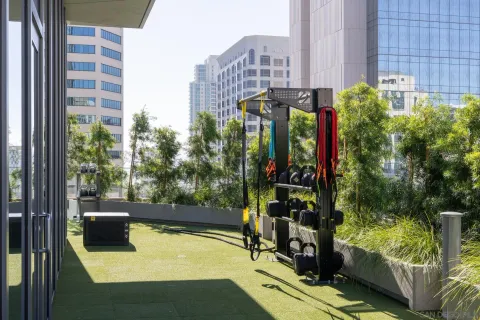 a living room with fireplace furniture and a large window