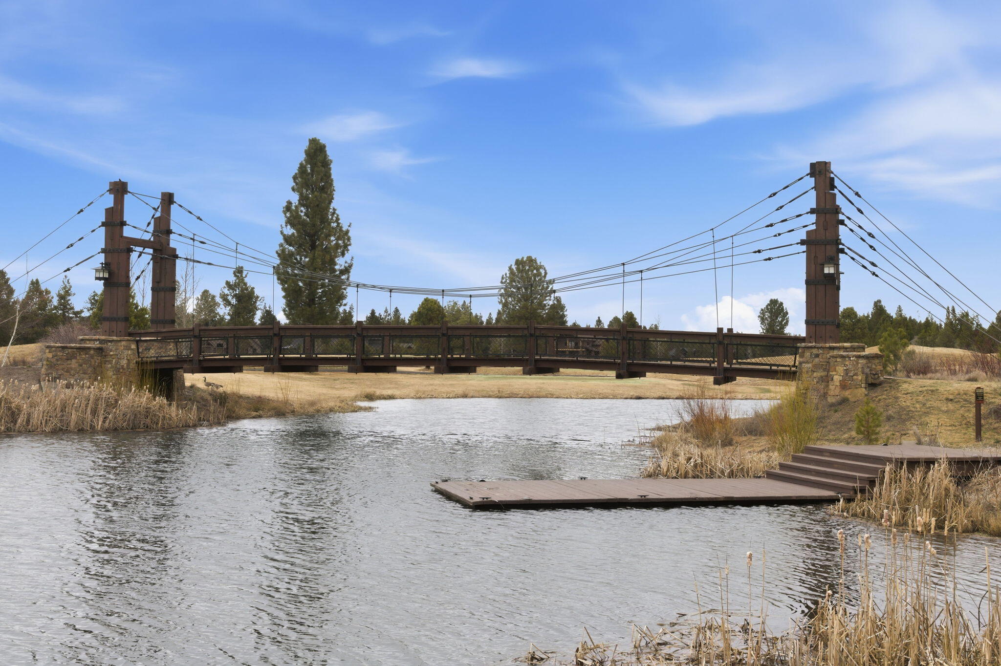 56508 Dancing Rock Loop, Unit 22 Bend, OR 97707 - Photo 56 of 69 a view of a lake with boats and large trees