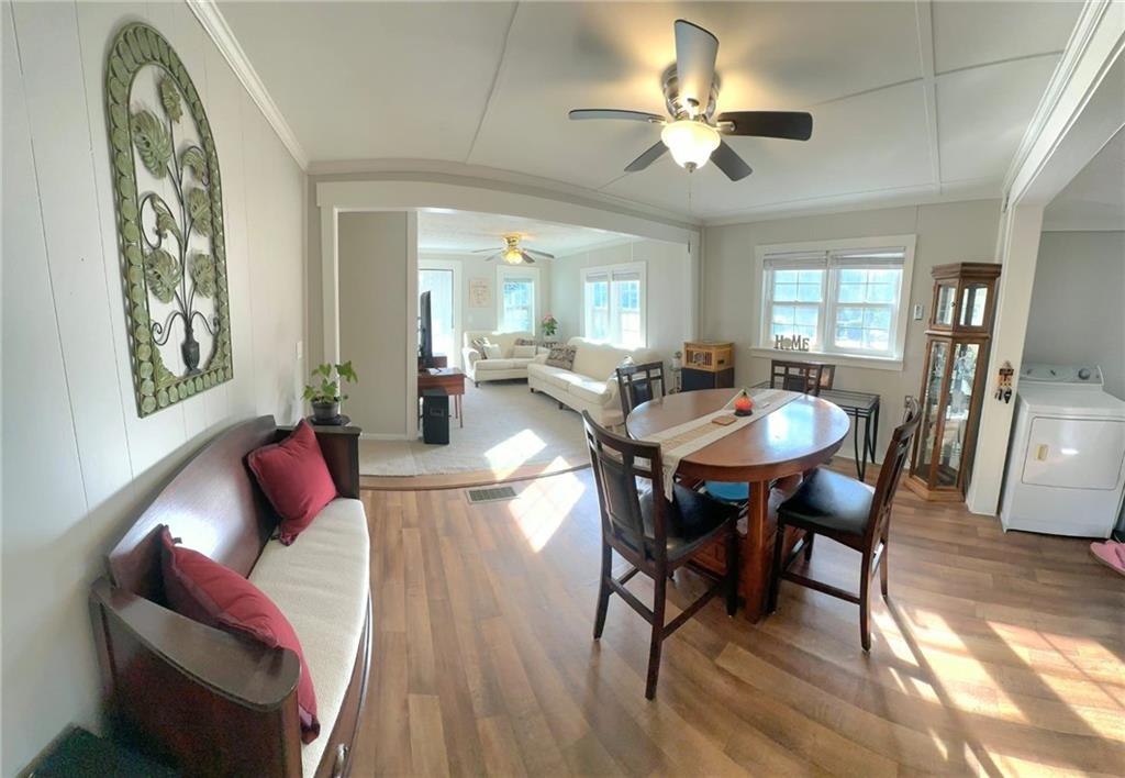 158 Rabbit Hill Road Dacula, GA 30019 - Photo 13 of 64 a view of a dining room with furniture and wooden floor