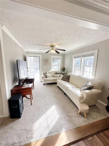 a hallway with a couch and dresser