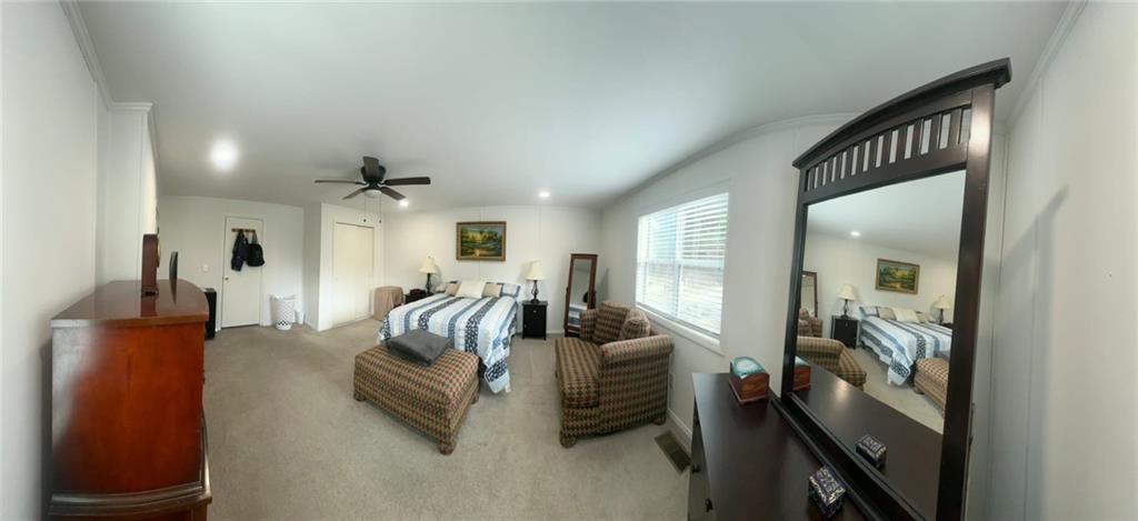 158 Rabbit Hill Road Dacula, GA 30019 - Photo 23 of 64 a hallway with a couch and dresser