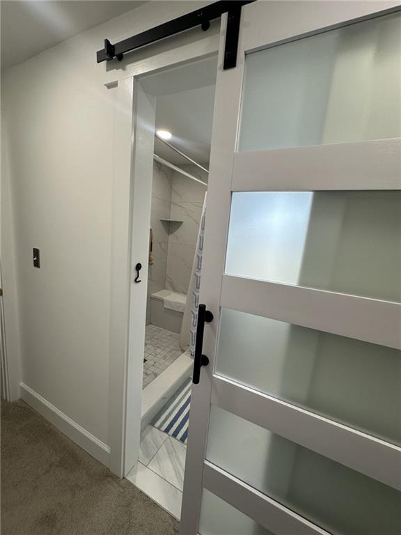 158 Rabbit Hill Road Dacula, GA 30019 - Photo 30 of 64 a bathroom with a shower and a sink