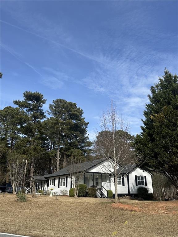 158 Rabbit Hill Road Dacula, GA 30019 - Photo 3 of 64 a front view of a house with a yard