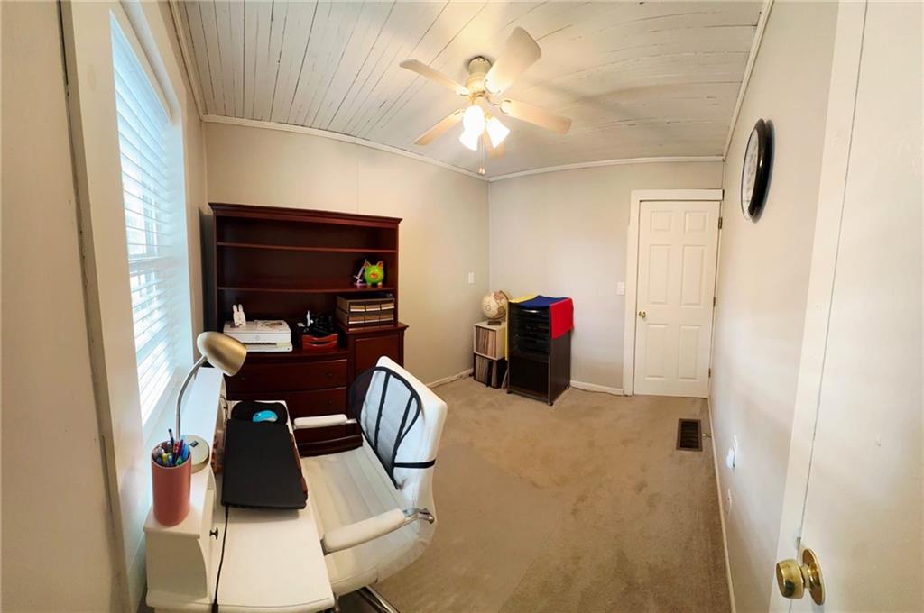 158 Rabbit Hill Road Dacula, GA 30019 - Photo 42 of 64 a view of a workspace with furniture and a window