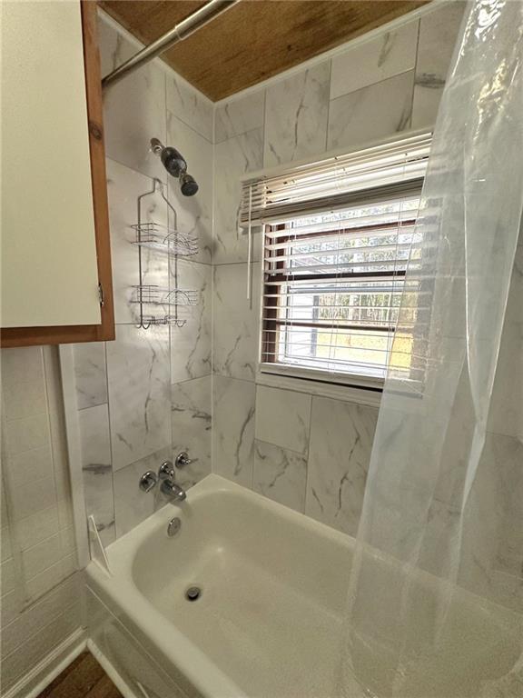 158 Rabbit Hill Road Dacula, GA 30019 - Photo 47 of 64 a bathroom with a tub a sink and a window