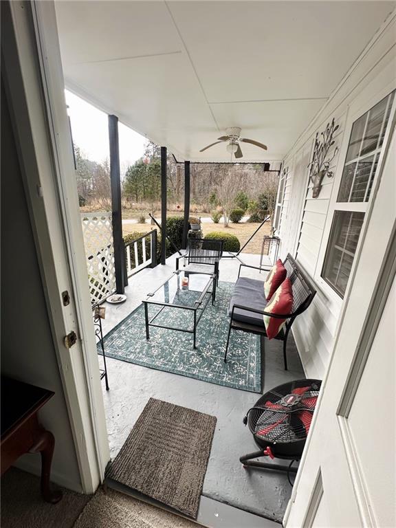 158 Rabbit Hill Road Dacula, GA 30019 - Photo 51 of 64 a view of living room with furniture and floor to ceiling window