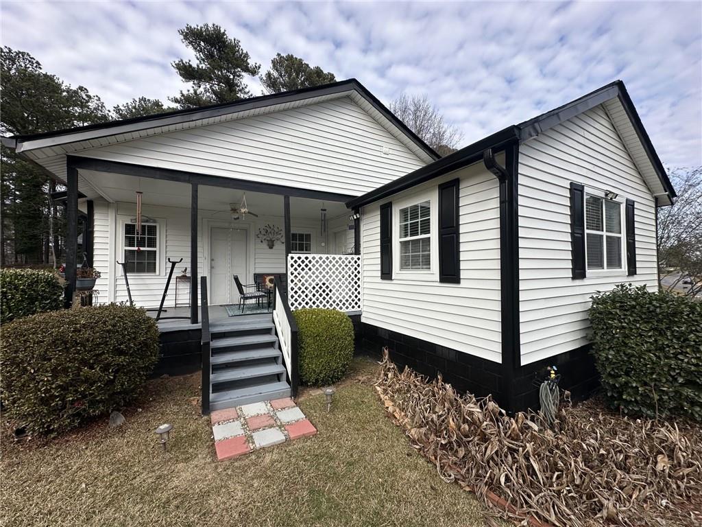 158 Rabbit Hill Road Dacula, GA 30019 - Photo 52 of 64 a front view of a house with a yard