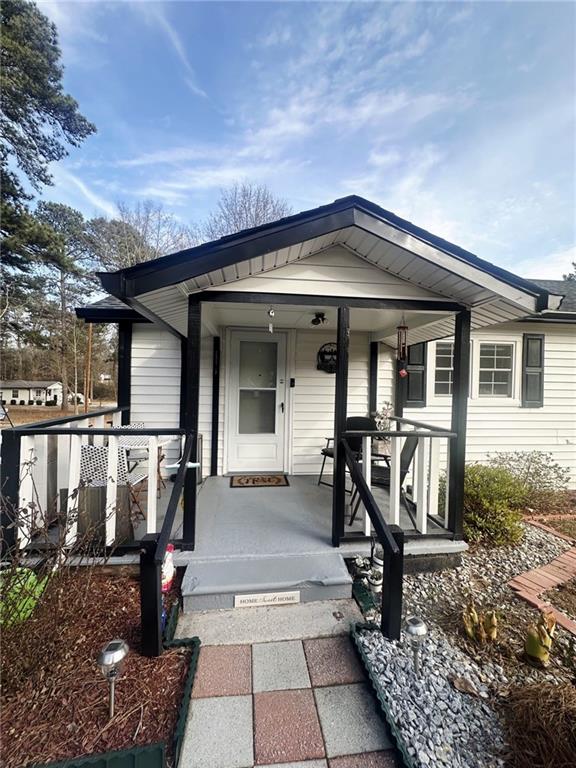 158 Rabbit Hill Road Dacula, GA 30019 - Photo 53 of 64 a front view of a house with porch
