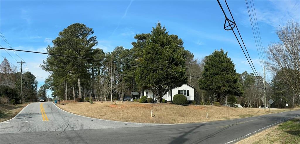 158 Rabbit Hill Road Dacula, GA 30019 - Photo 56 of 64 a house with trees in front of it