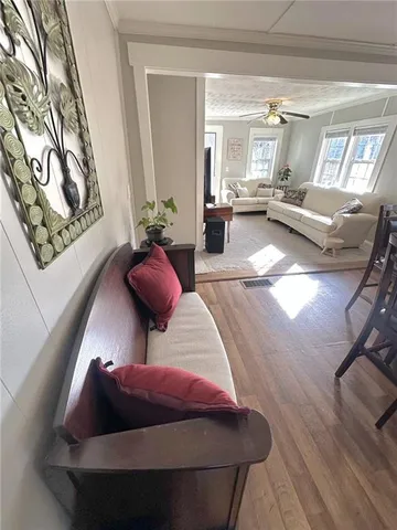 a view of a dining room with furniture window and wooden floor