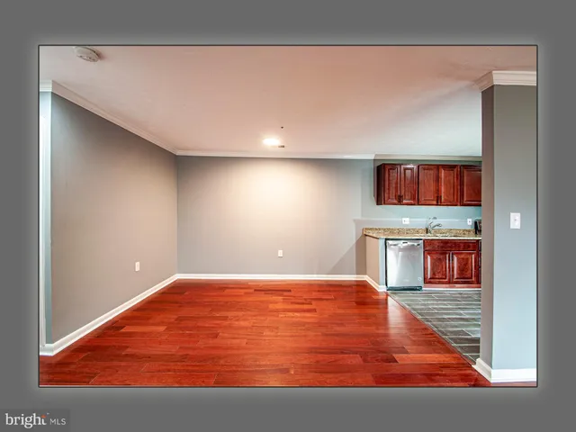 a kitchen with stainless steel appliances granite countertop a refrigerator a stove and a sink